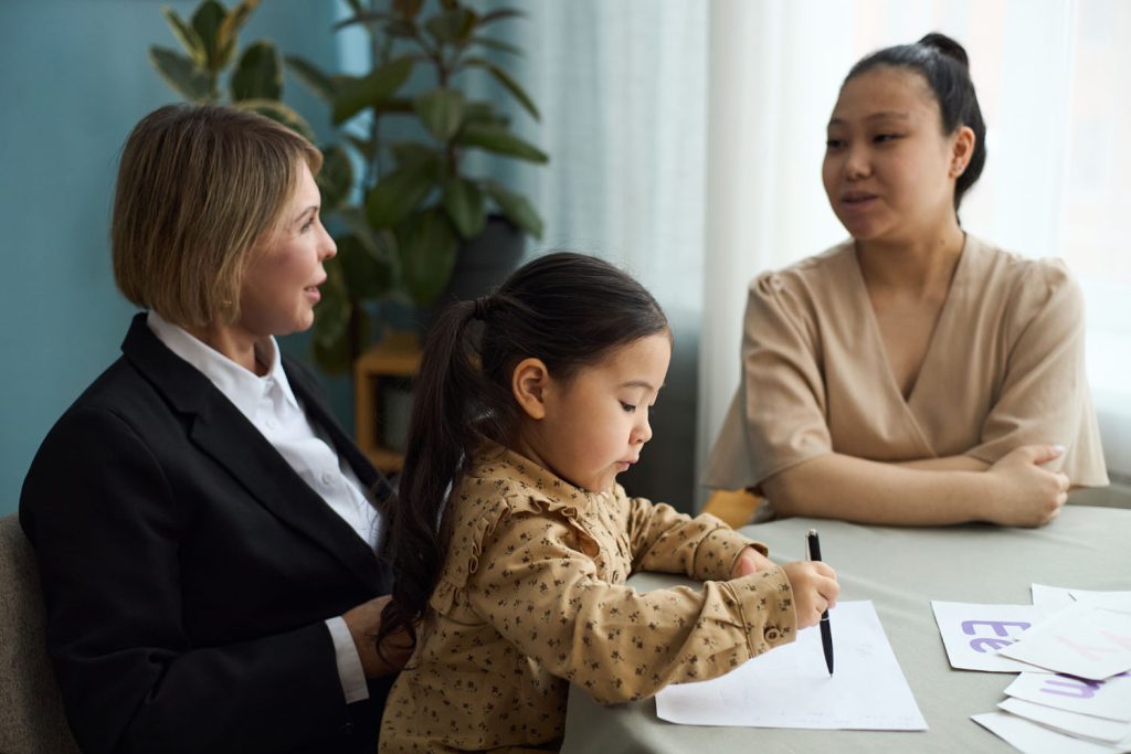 Mother and daughter meeting with a family law attorney