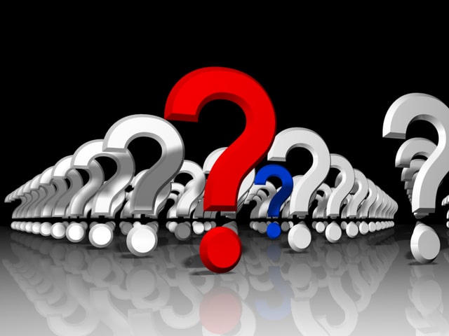 Rows of question marks with a red question mark in front
